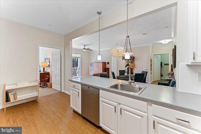 kitchen with a sink, white cabinets, open floor plan, light wood-type flooring, and dishwasher