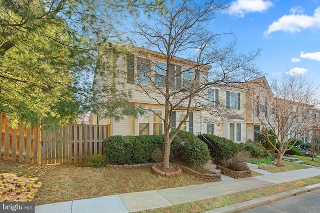 view of front of property with fence