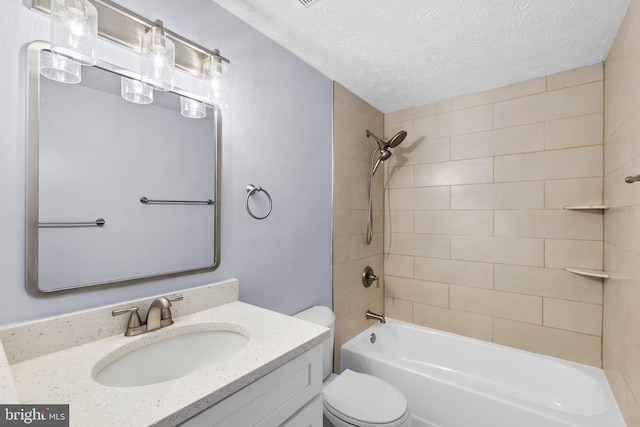 full bathroom featuring vanity, shower / tub combination, toilet, and a textured ceiling