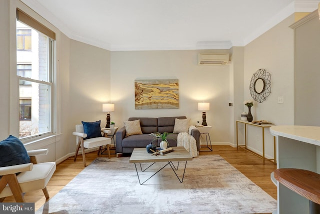 living room with light wood-style floors, plenty of natural light, crown molding, and a wall mounted air conditioner