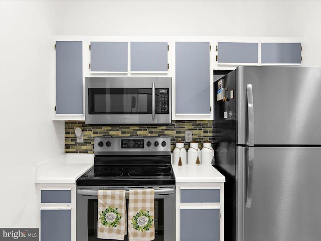 kitchen with stainless steel appliances, backsplash, and light countertops