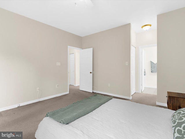 carpeted bedroom with baseboards