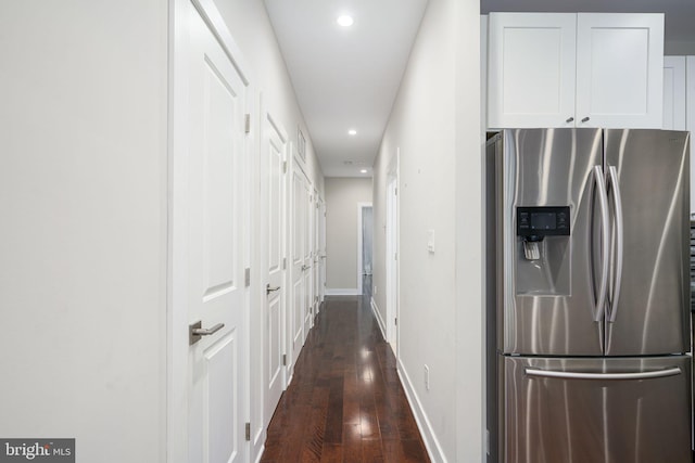 hallway with baseboards, dark wood finished floors, and recessed lighting