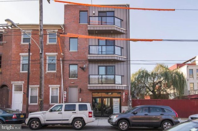 view of building exterior with fence