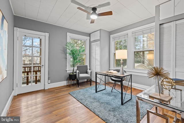 office with a ceiling fan, wood-type flooring, and baseboards