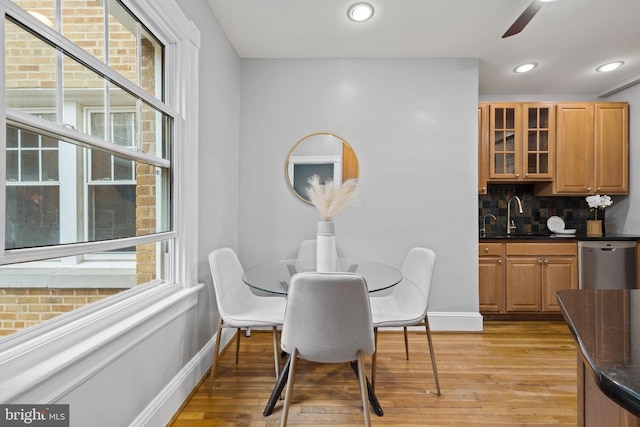 dining room with light wood-style floors, recessed lighting, baseboards, and a ceiling fan