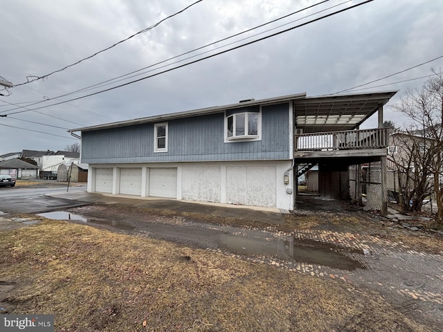 exterior space featuring a deck and community garages