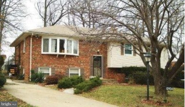 bi-level home with brick siding