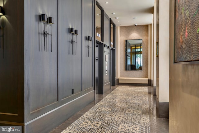 hallway with recessed lighting and elevator