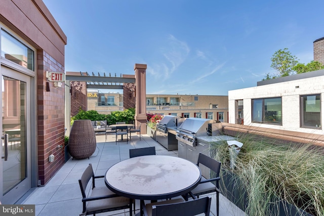 view of patio featuring grilling area, area for grilling, and outdoor dining space