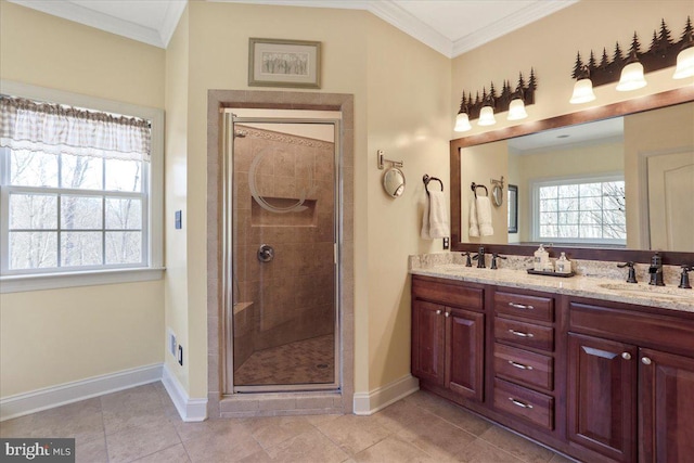 full bathroom with crown molding, a sink, and a shower stall