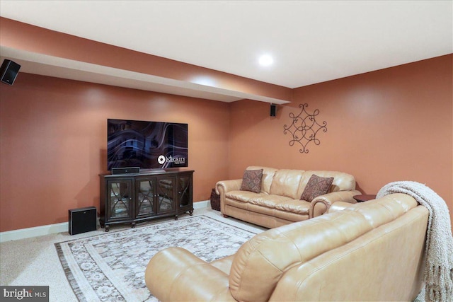 carpeted living room with recessed lighting and baseboards