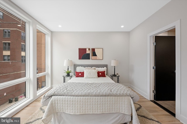 bedroom featuring recessed lighting, baseboards, and wood finished floors