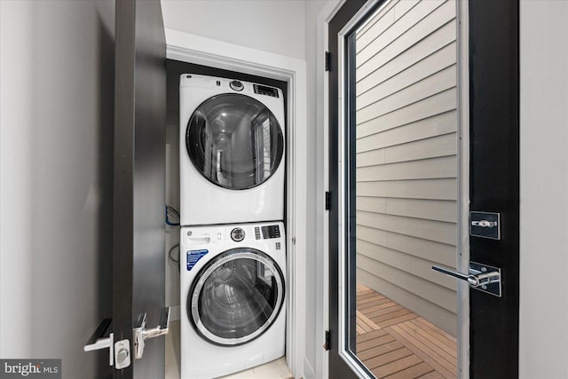 laundry area with laundry area and stacked washer and dryer