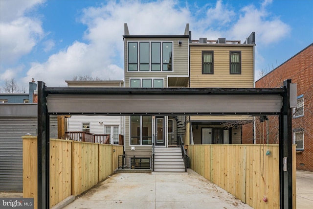 rear view of property with fence