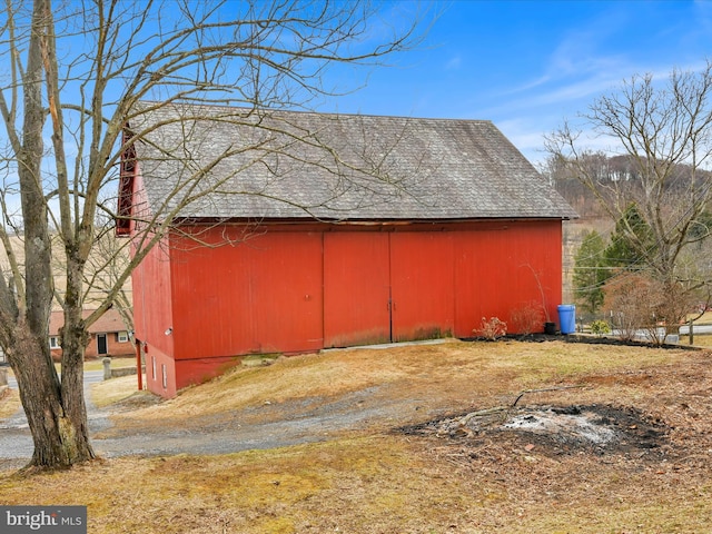 view of side of property featuring an outbuilding and a barn