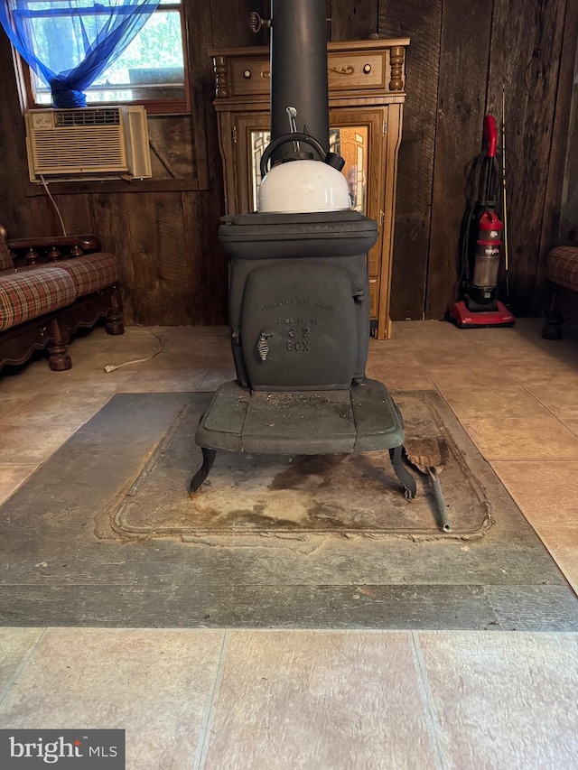 interior details featuring a wood stove and cooling unit