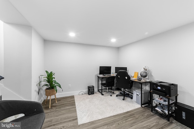 office space with baseboards, wood finished floors, and recessed lighting