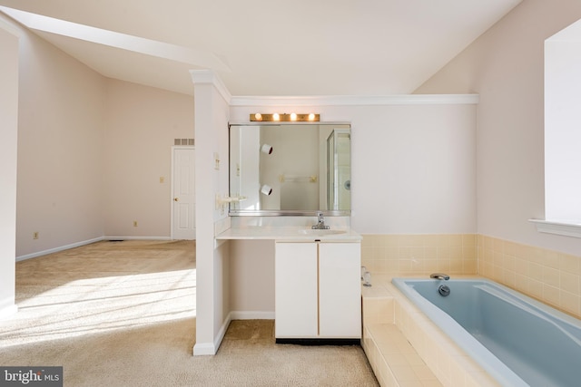 full bath featuring lofted ceiling, baseboards, vanity, and a bath