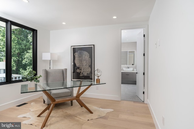 office area featuring baseboards, light wood-style flooring, visible vents, and recessed lighting