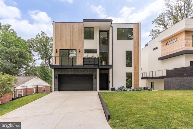 contemporary house with a garage, driveway, a front lawn, and a balcony