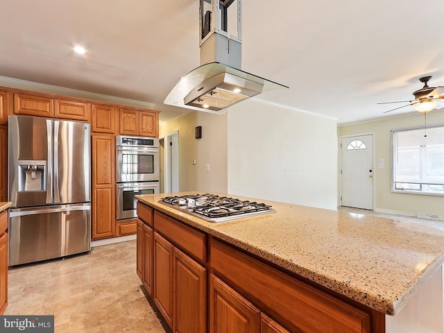 kitchen featuring appliances with stainless steel finishes, brown cabinetry, and crown molding