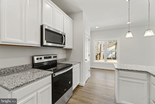 kitchen with recessed lighting, light wood-style flooring, appliances with stainless steel finishes, white cabinets, and baseboards