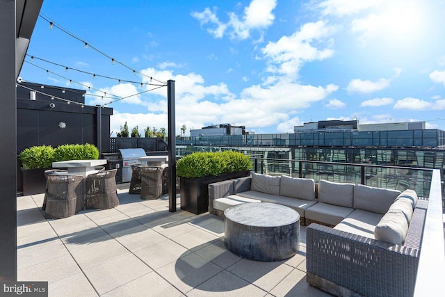 view of patio featuring outdoor lounge area and a city view