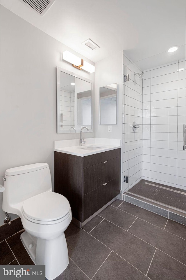 full bath with toilet, tile patterned flooring, visible vents, and a shower stall