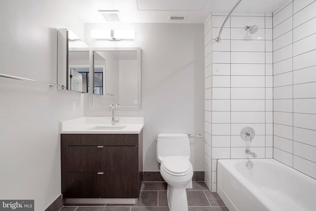 full bathroom featuring toilet, vanity, visible vents,  shower combination, and tile patterned floors