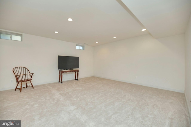 interior space with baseboards, light colored carpet, and recessed lighting