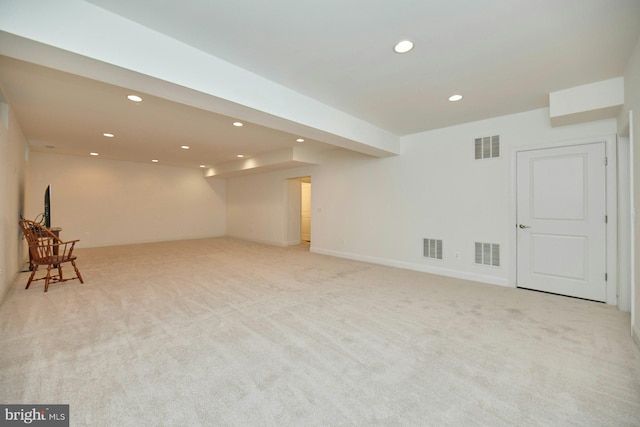 basement with recessed lighting and visible vents