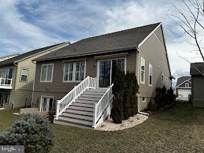 view of front of house with stairs