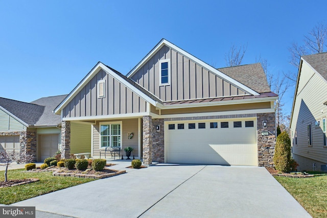 craftsman inspired home with metal roof, a porch, concrete driveway, board and batten siding, and a standing seam roof