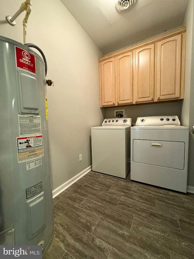 laundry area with cabinet space, visible vents, dark wood-style floors, washer and dryer, and water heater