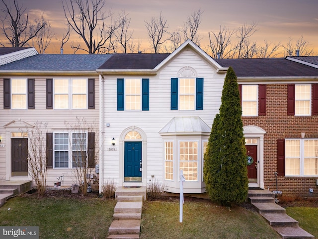 view of property with a front lawn