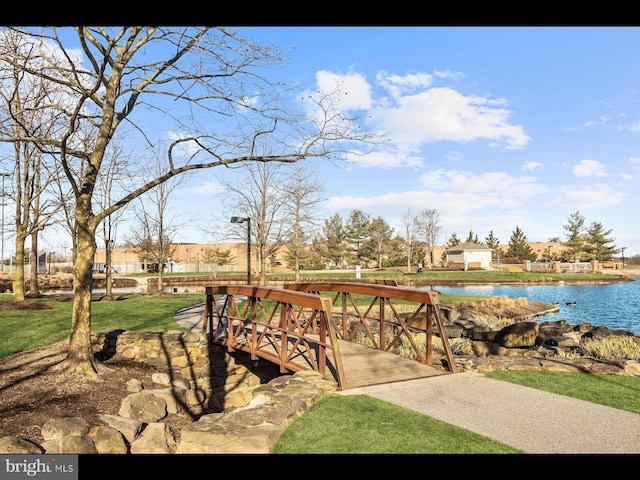 view of community with a water view