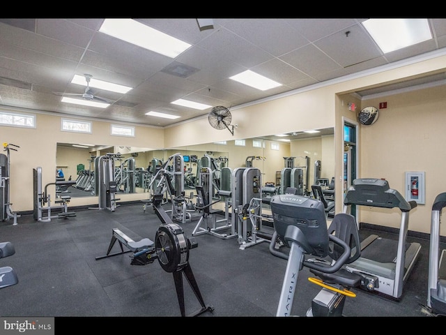 workout area with a paneled ceiling