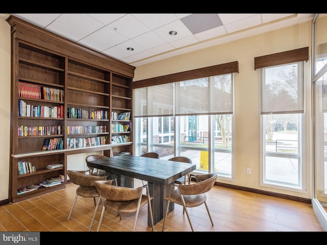 dining area featuring baseboards and wood finished floors