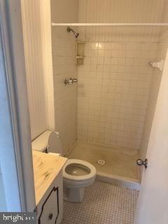 full bathroom with vanity, tile patterned flooring, a shower stall, and toilet