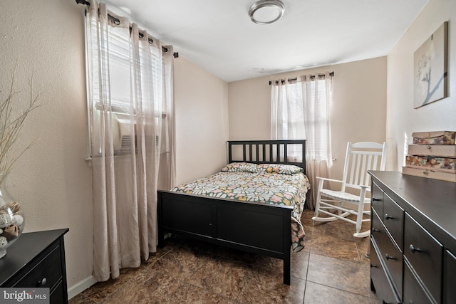 bedroom featuring baseboards