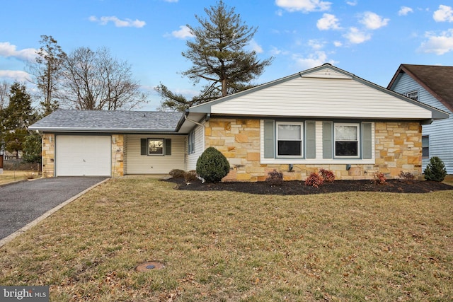 view of front of house with driveway, a garage, a shingled roof, stone siding, and a front lawn