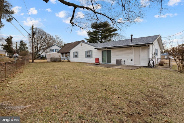 rear view of property with a fenced backyard, a patio, and a yard