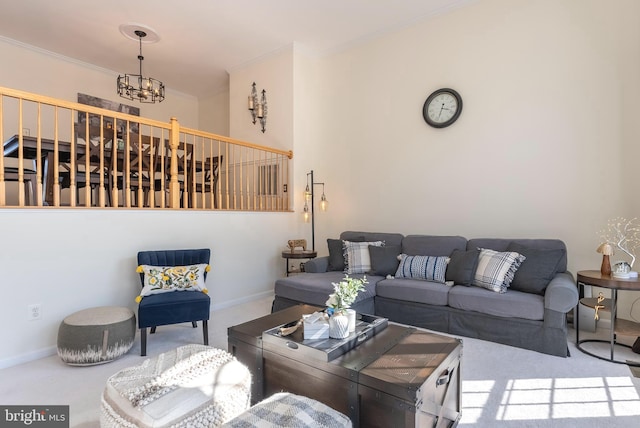 living area featuring a chandelier, baseboards, carpet floors, and ornamental molding