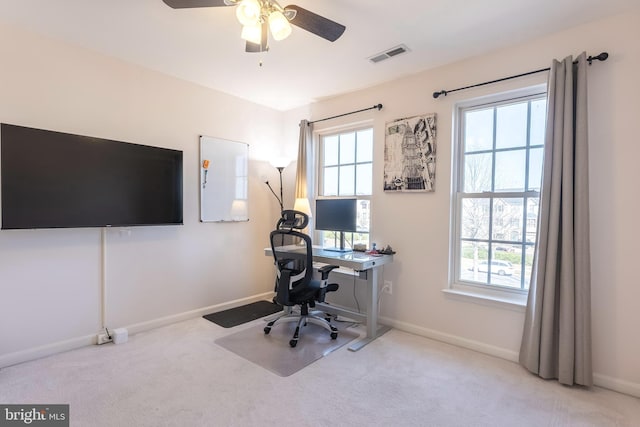 home office with carpet flooring, baseboards, and visible vents