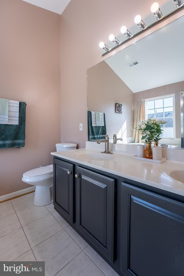 full bathroom featuring tile patterned floors, visible vents, toilet, a sink, and double vanity