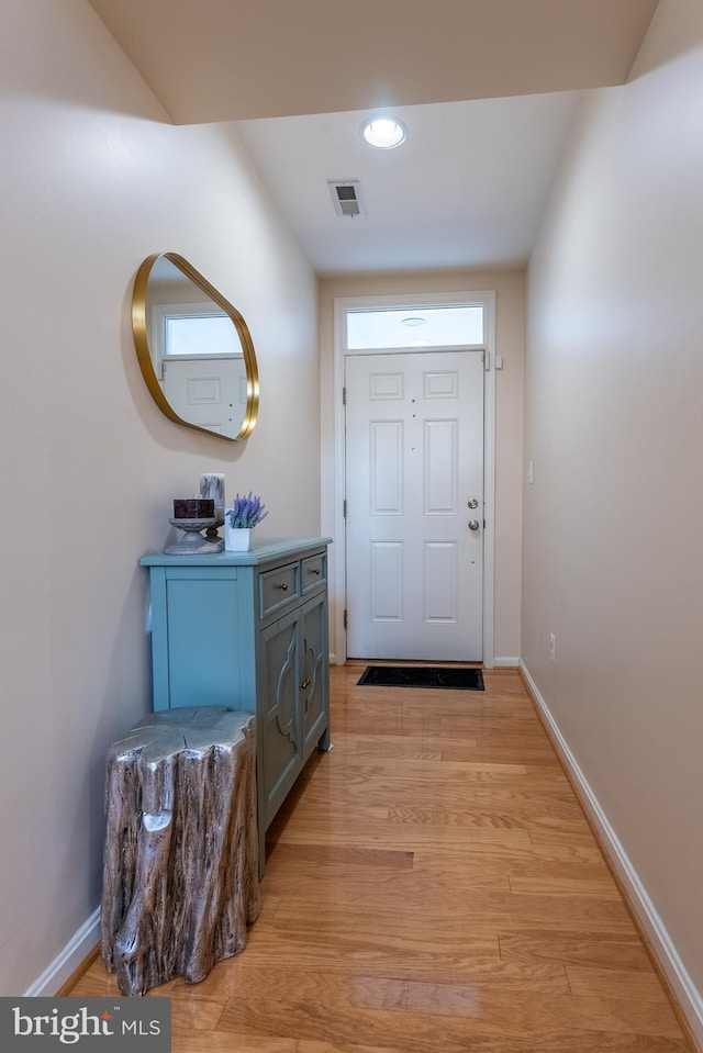 entryway featuring visible vents, baseboards, and light wood-style floors