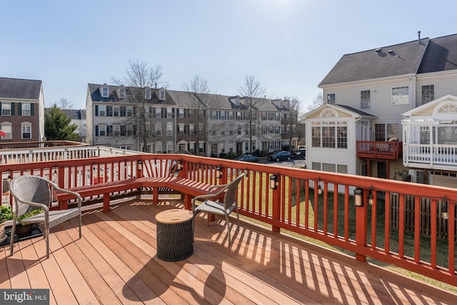 wooden deck with a residential view