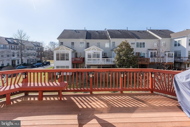 wooden deck featuring a residential view