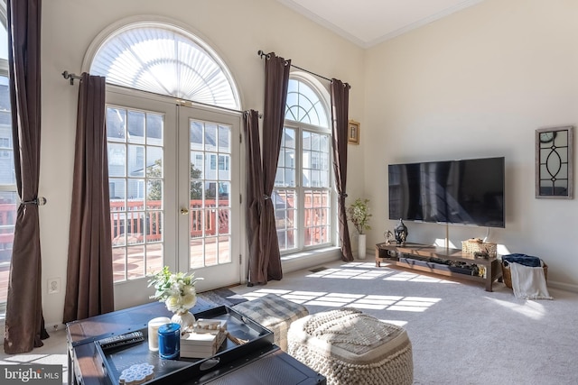 carpeted living room featuring crown molding